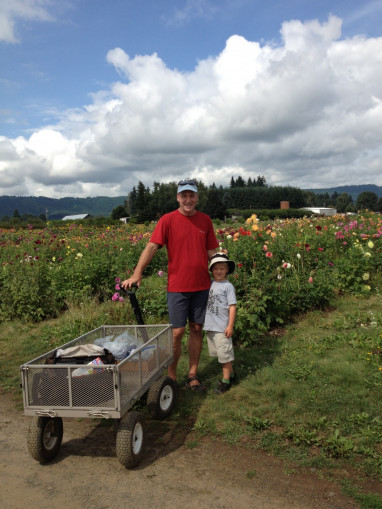    Peter Mortola and his son Riley with a completely different set of wheels at Sauvie Island collecting berries. Riley and his brother N...