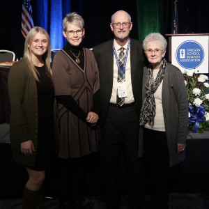 Darin Drill, second from right, poses with his family at the 2023 Oregon School Boards Association Convention in November.