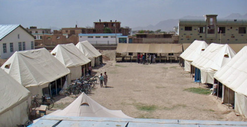 A school in Wardak province, about 40 miles from Kabul. Students sit on dirt floors in these tents. Surrounding buildings are mostly dest...